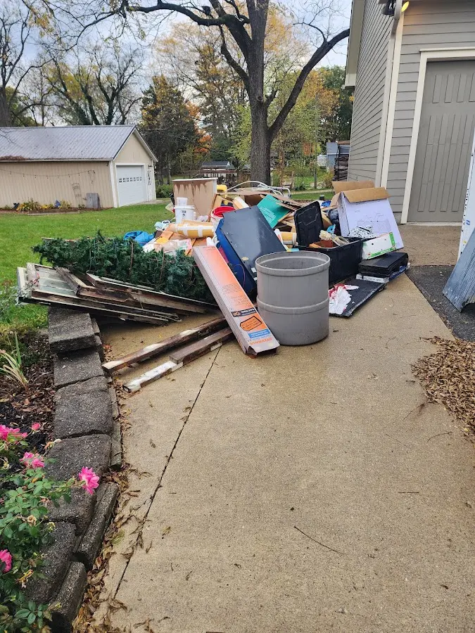Dumpster being loaded with debris for 30 Yard Dumpster Rental in High Bridge